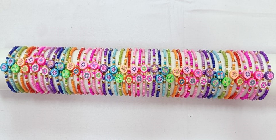 BRACCIALE PERLINE E FIMO SU TUBO